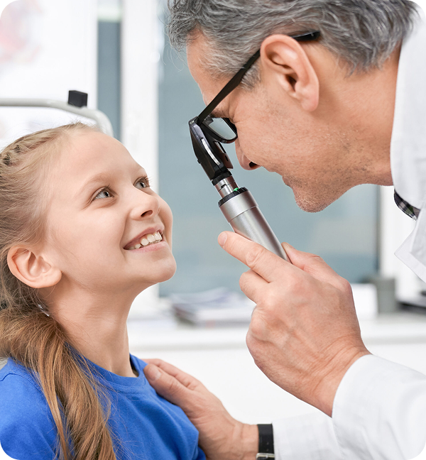 oculist checking with special tool eyes of girl