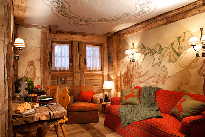 the living room of la petite in courmayeur showing the sofa and spaces of the house