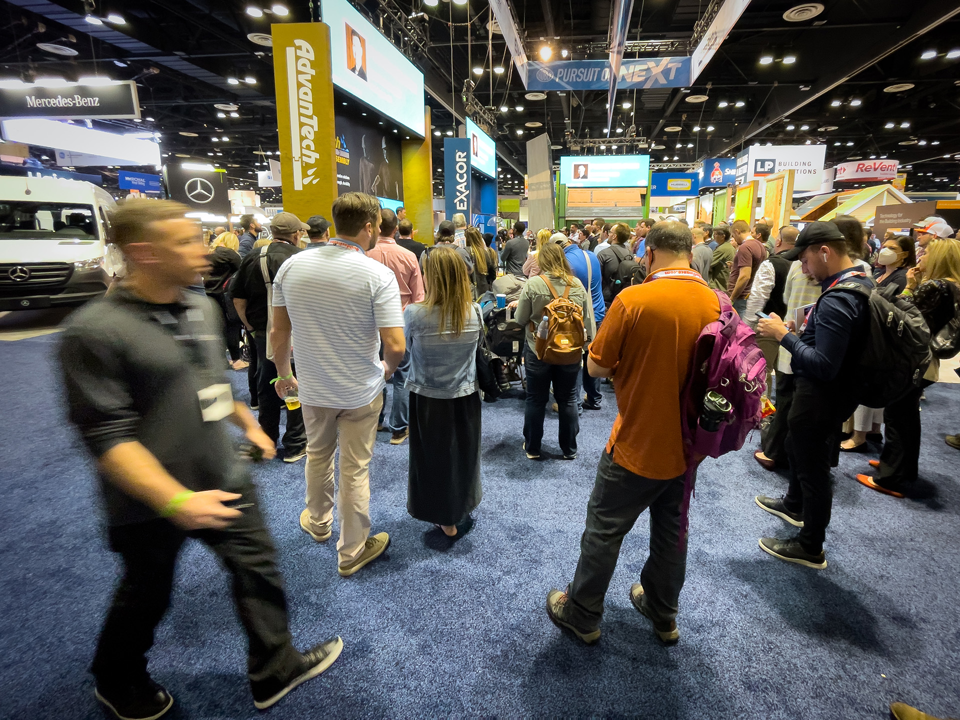 Chaos and bustle n a trade show booth 