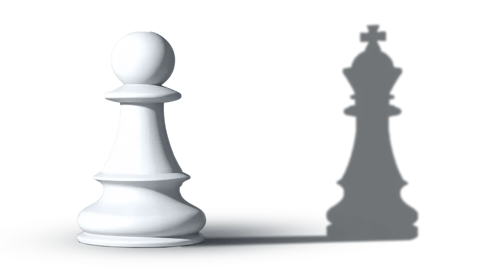 A white pawn chess piece casting a shadow of a black king chess piece on a light surface.