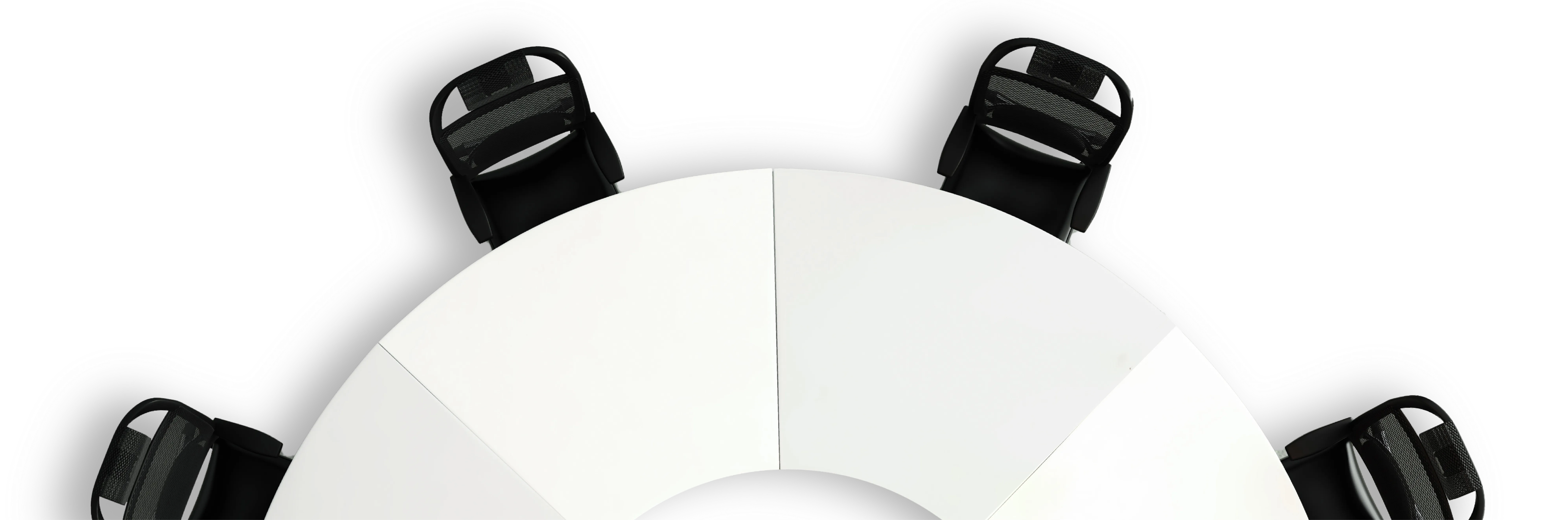 Top-down view of a round white table with four black mesh office chairs evenly spaced around it.