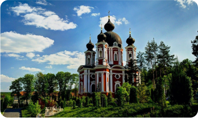 Architectural structure of a building with multiple domes amidst natural elements.