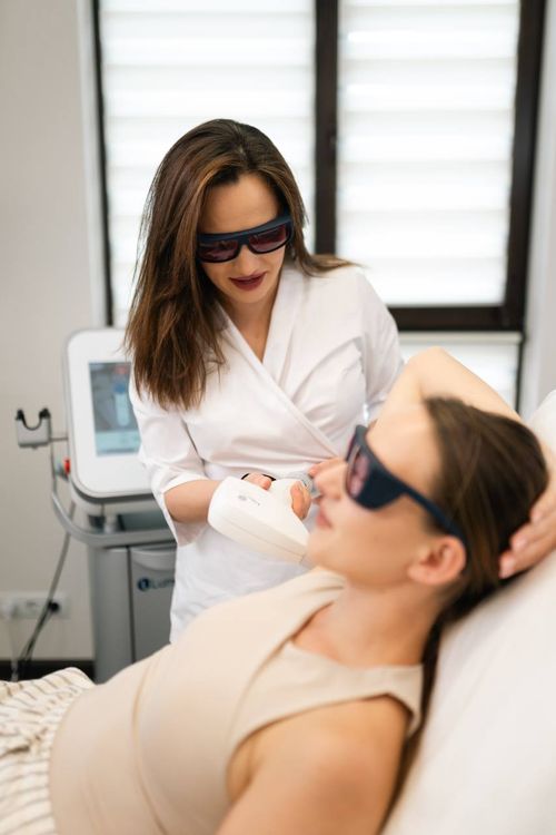 A person receiving a medical aesthetic procedure.