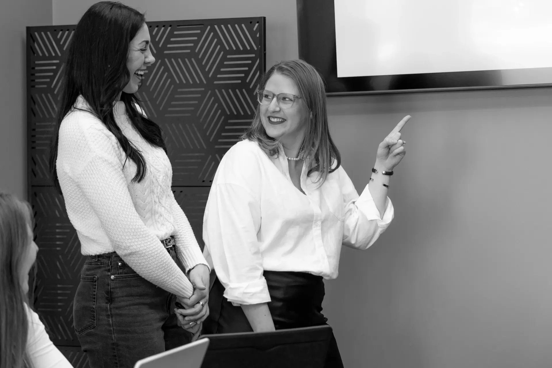 pointing at screen giving presentation