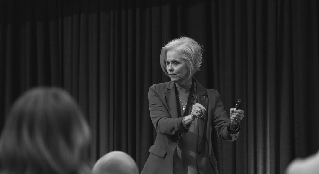 deanna speaking on stage at blaze expo