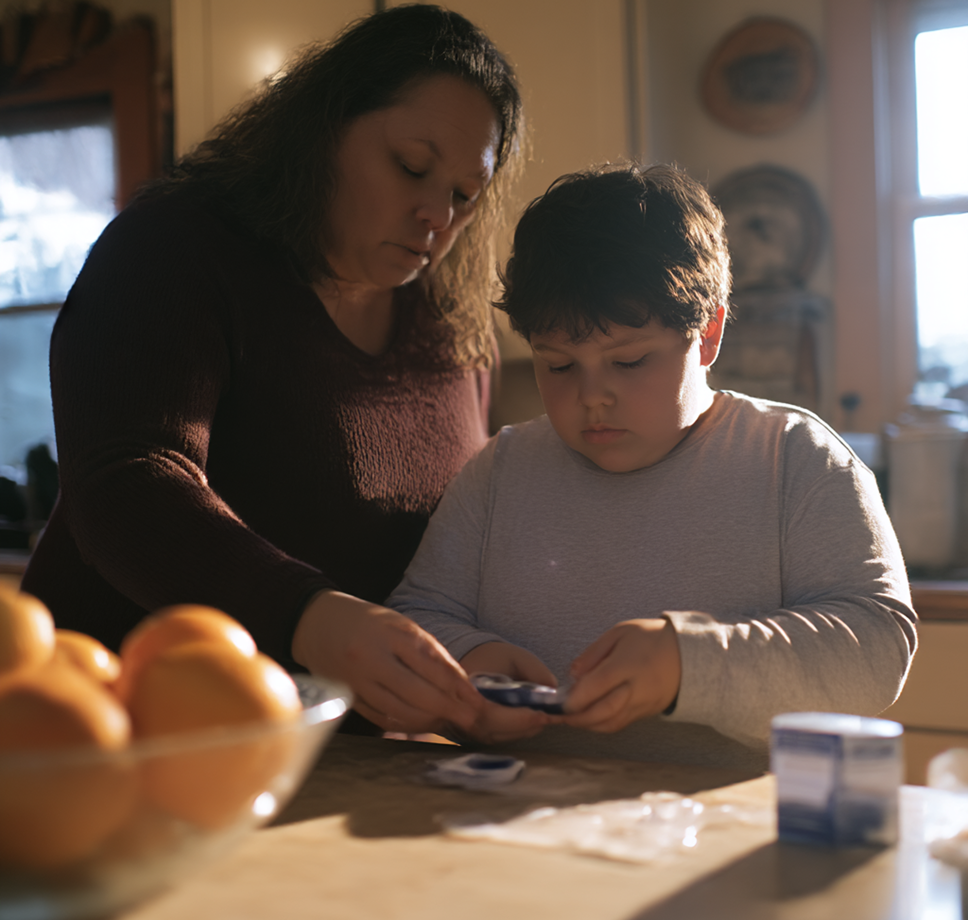 Grandmother handling a medication to child