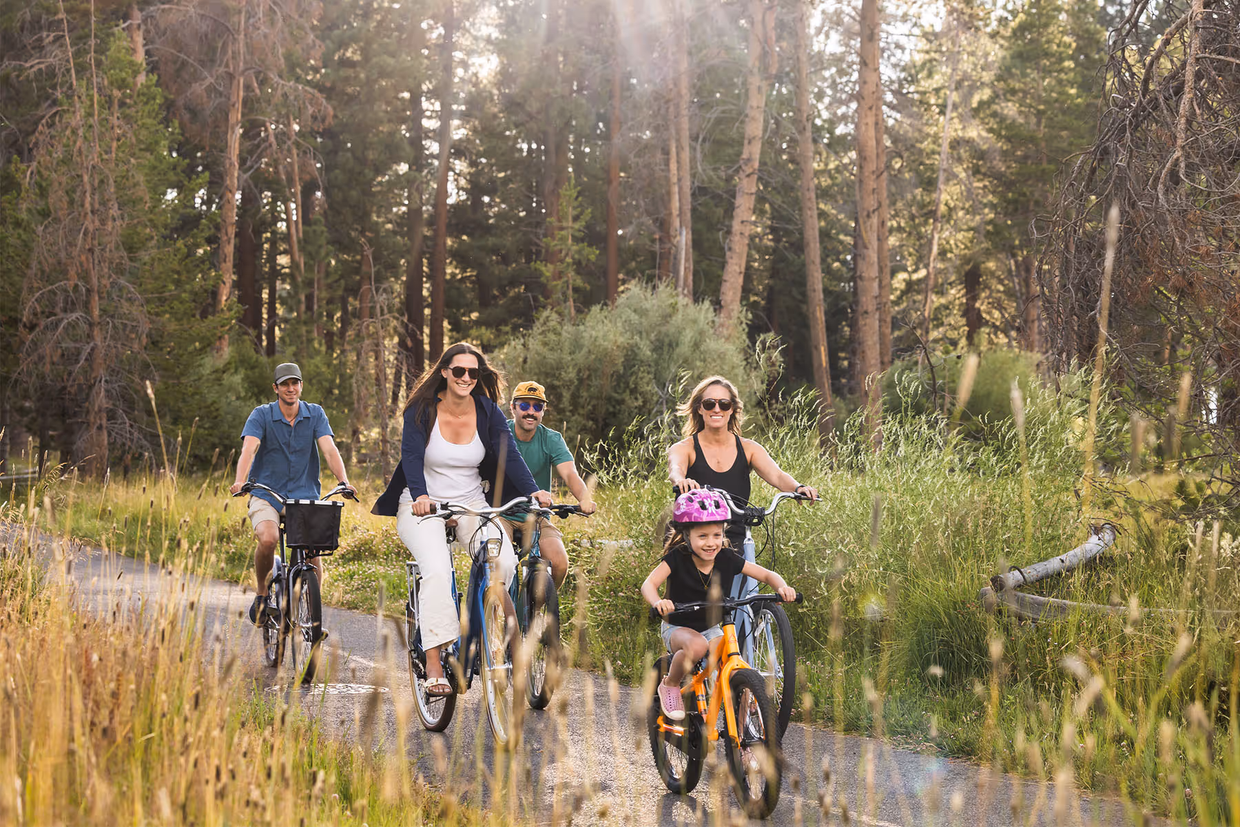 Family on bike rentals riding to Pope Beach