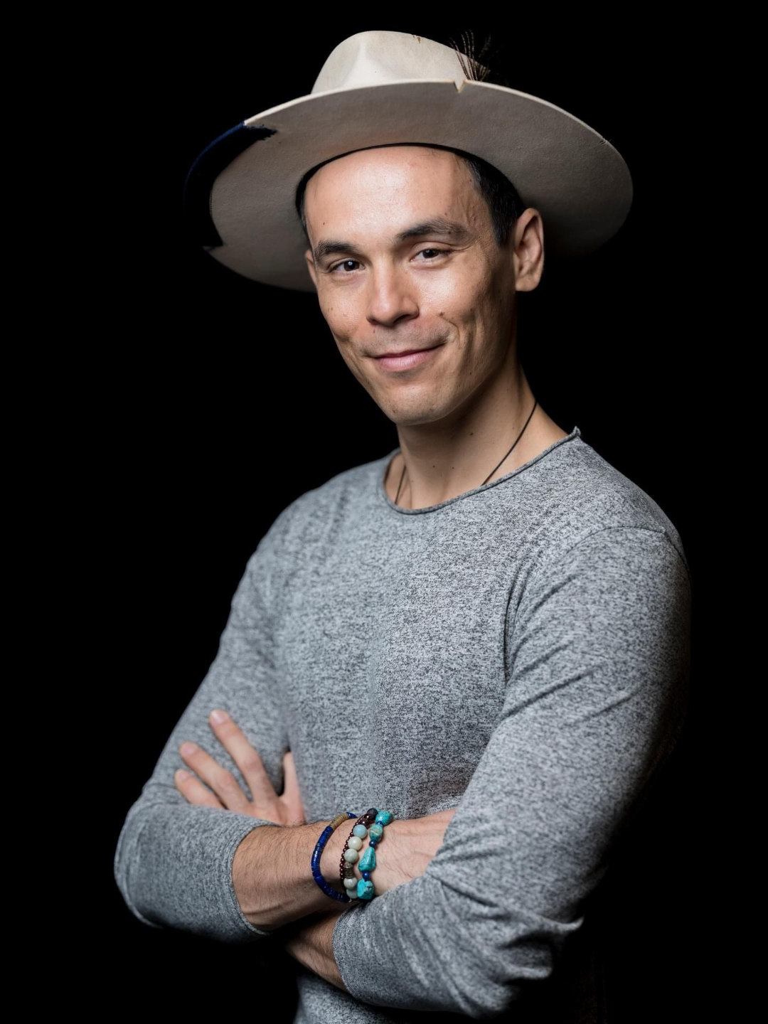 Adam Roa portrait wearing a hat