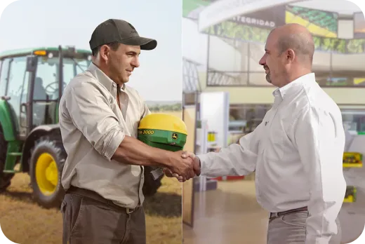 Two men standing in a field looking at and interacting with a tablet displaying digital icons.