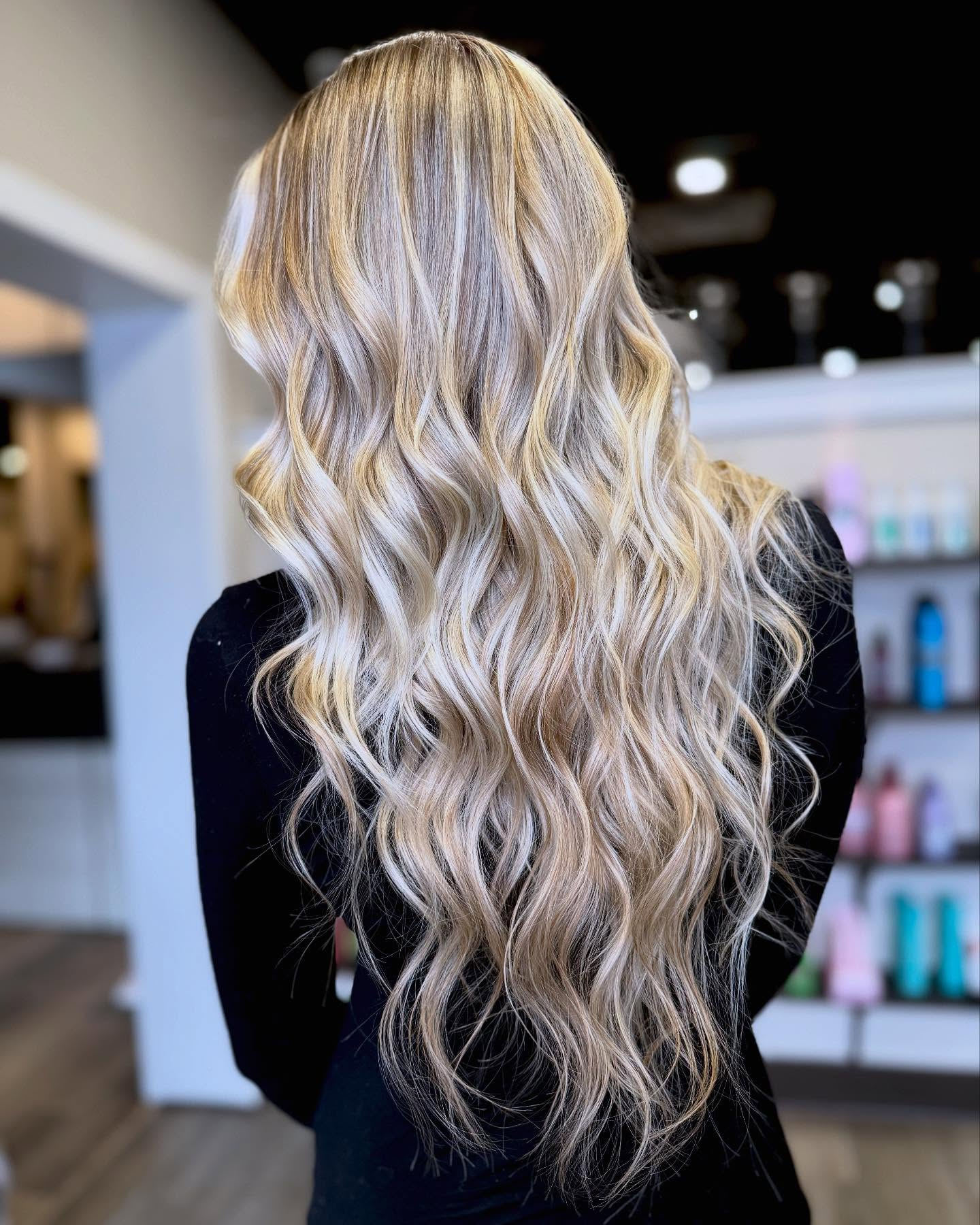 Mirror image of a blonde hair style with beautiful layers 