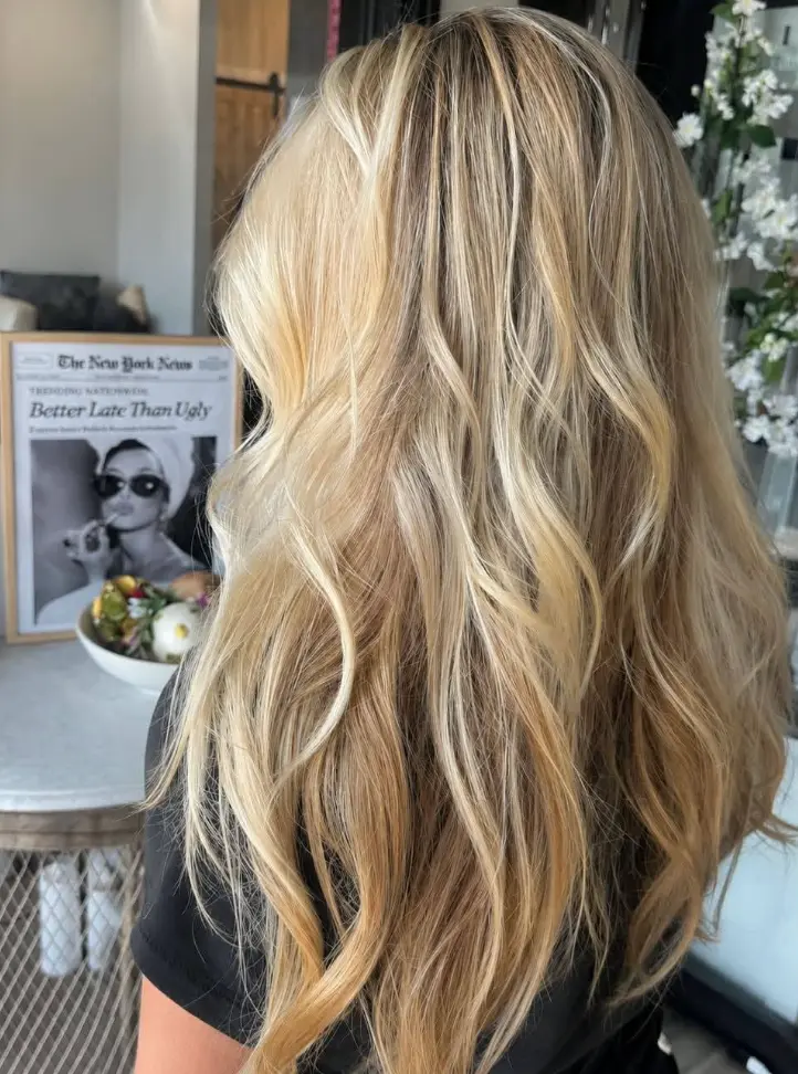 Dimensional balayage blonde hair finished with a L’Oréal Professionnel Keratin Alpha Sleek Treatment at Razberri’s Hair, Nail & Spa in Toms River, NJ.