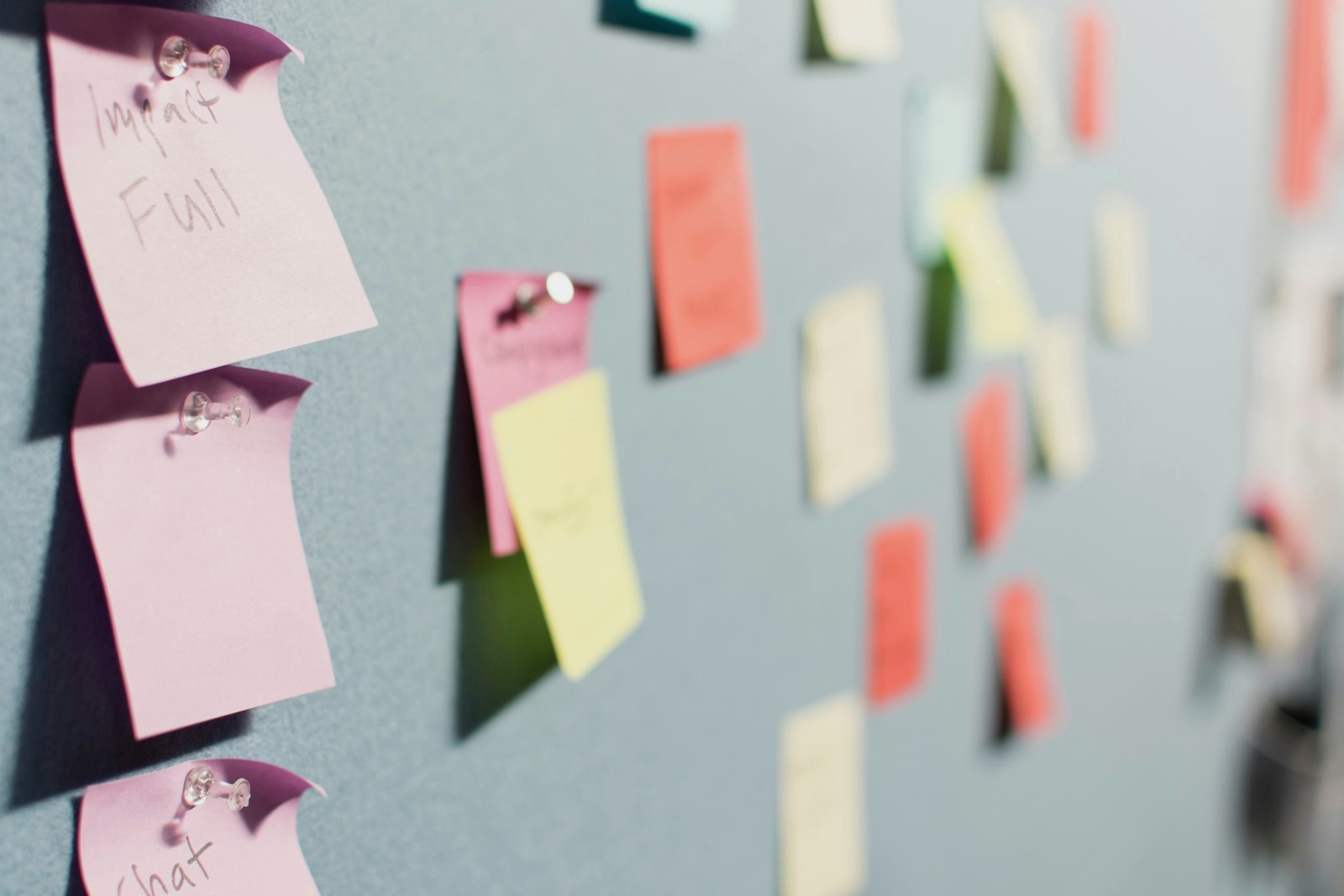 Stock image of sticky notes on wall to represent the planning stages of a website for nonprofits.