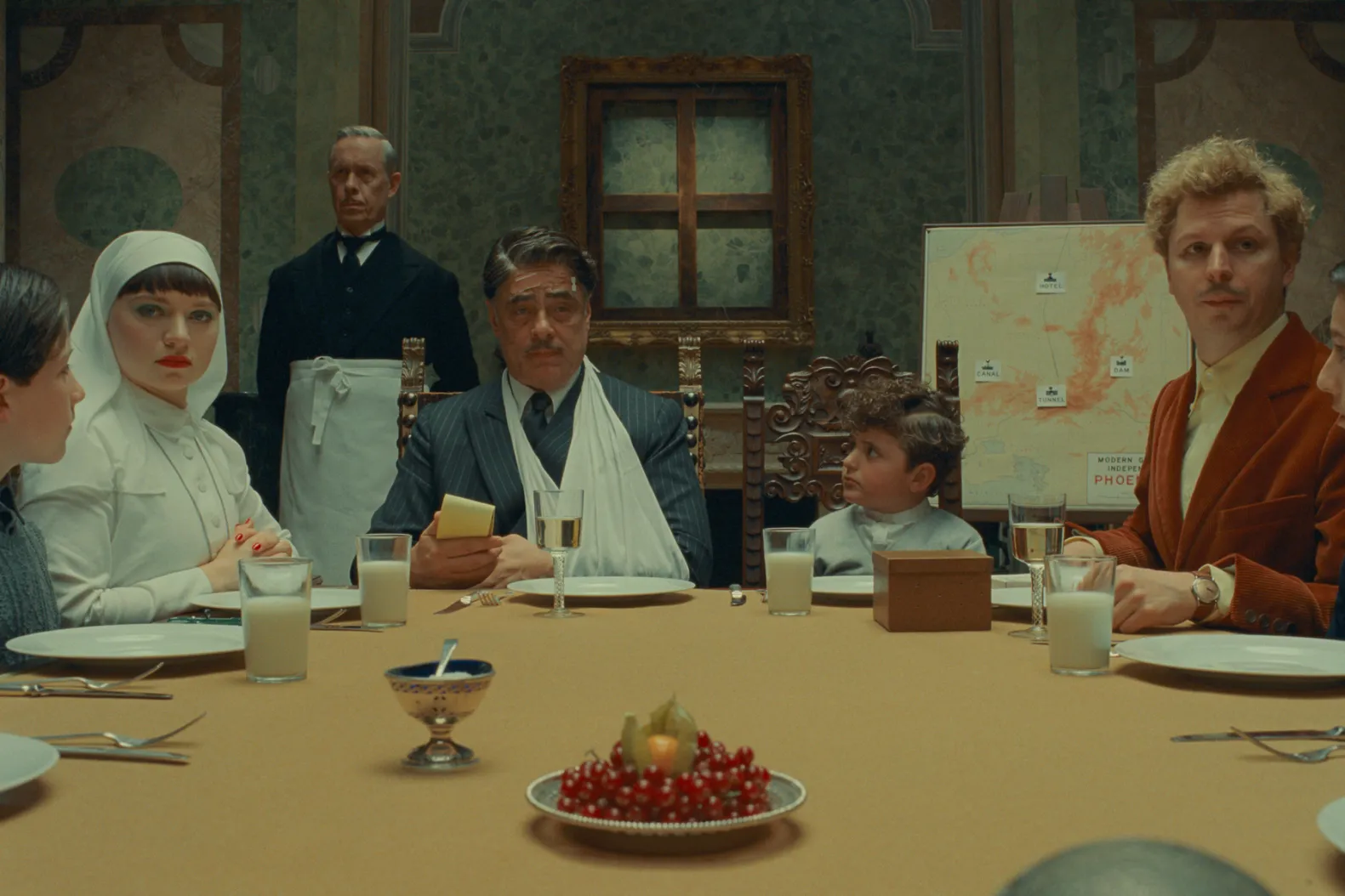 Dinner scene still from Wes Anderson's 2025 film The Phoenician Scheme