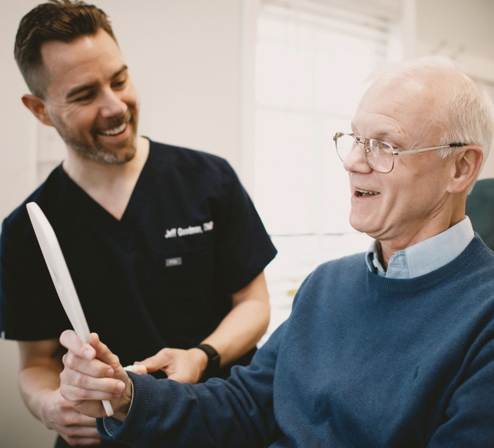 Elderly patient looking at himself in the mirror