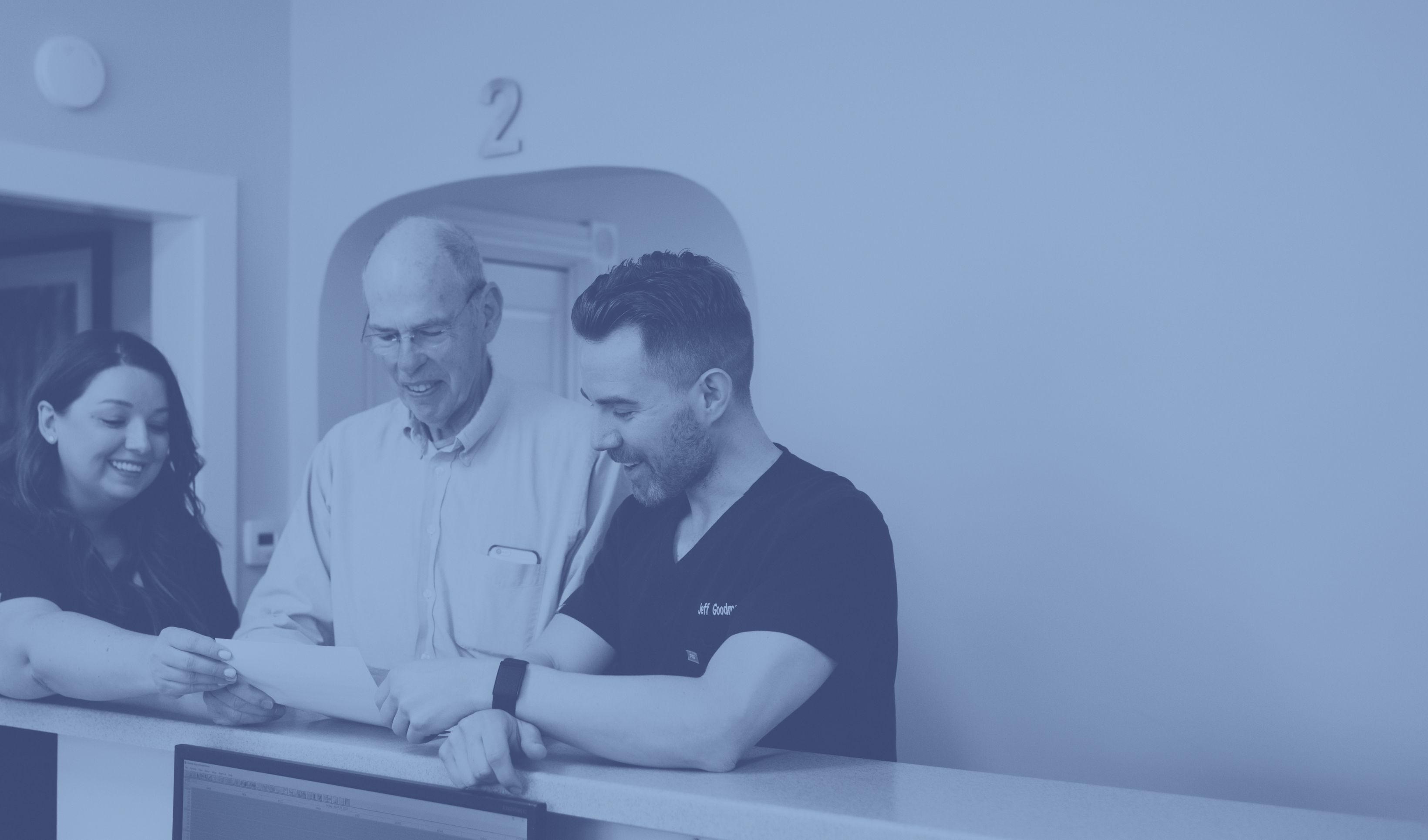 Dr. Goodman welcoming an elderly patient