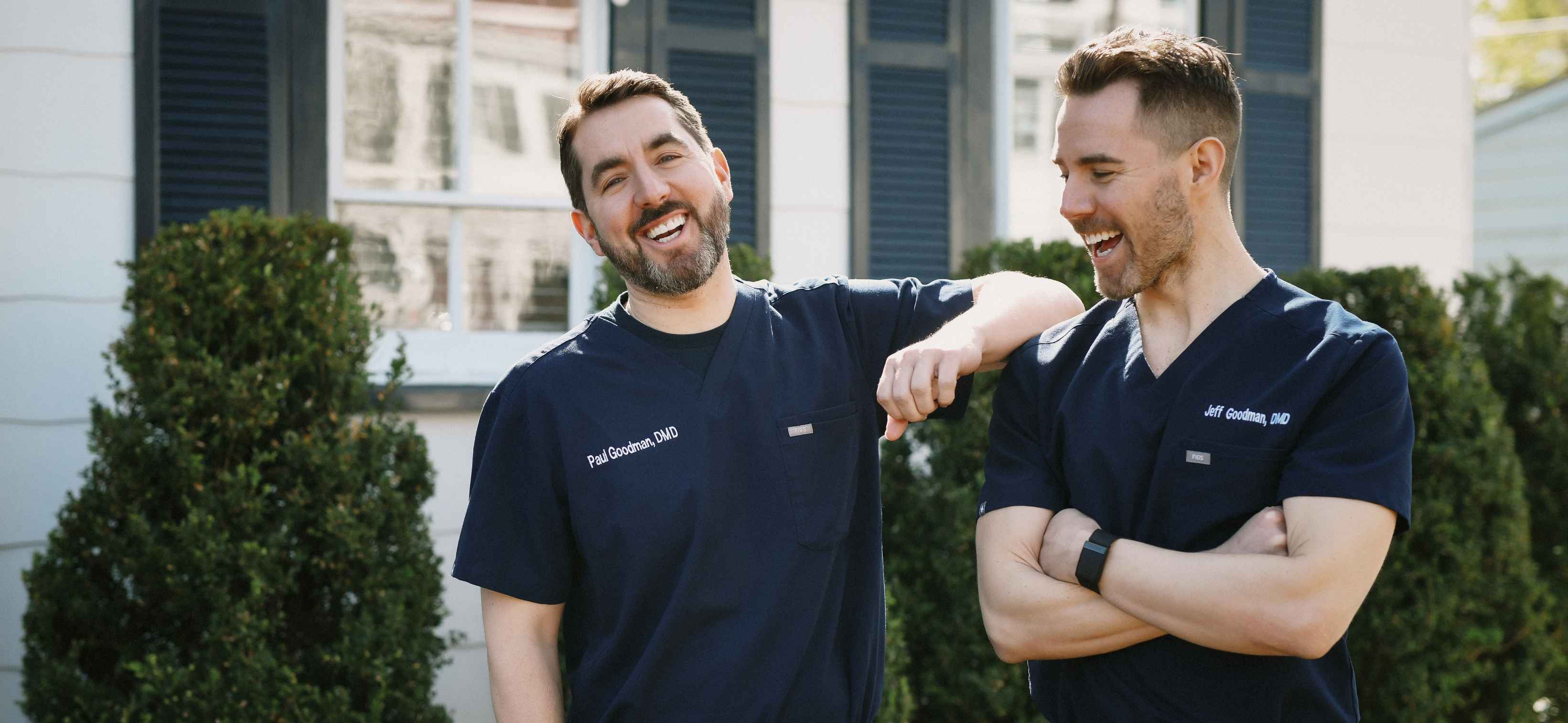 Goodman brothers laughing with each other