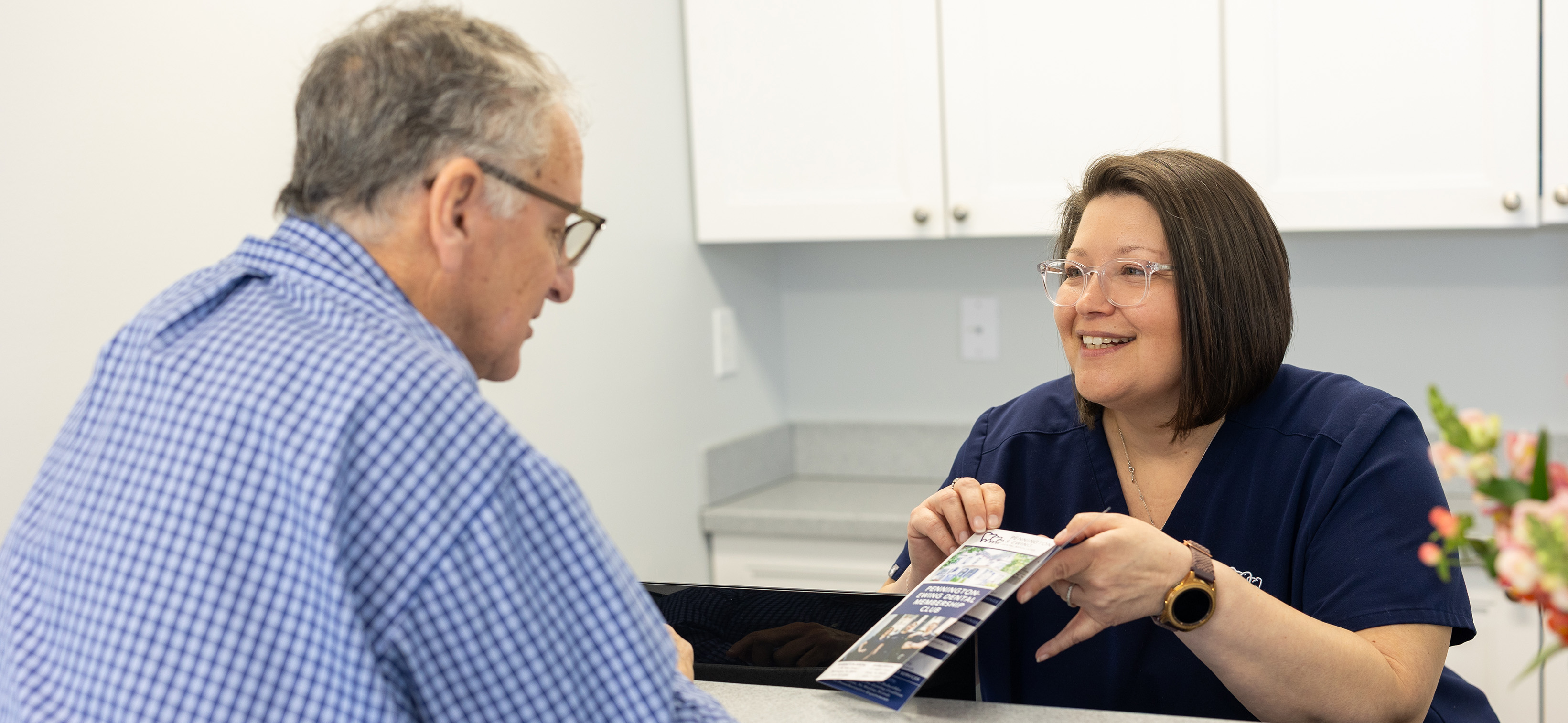 Reviewing the dental membership plan with a patient