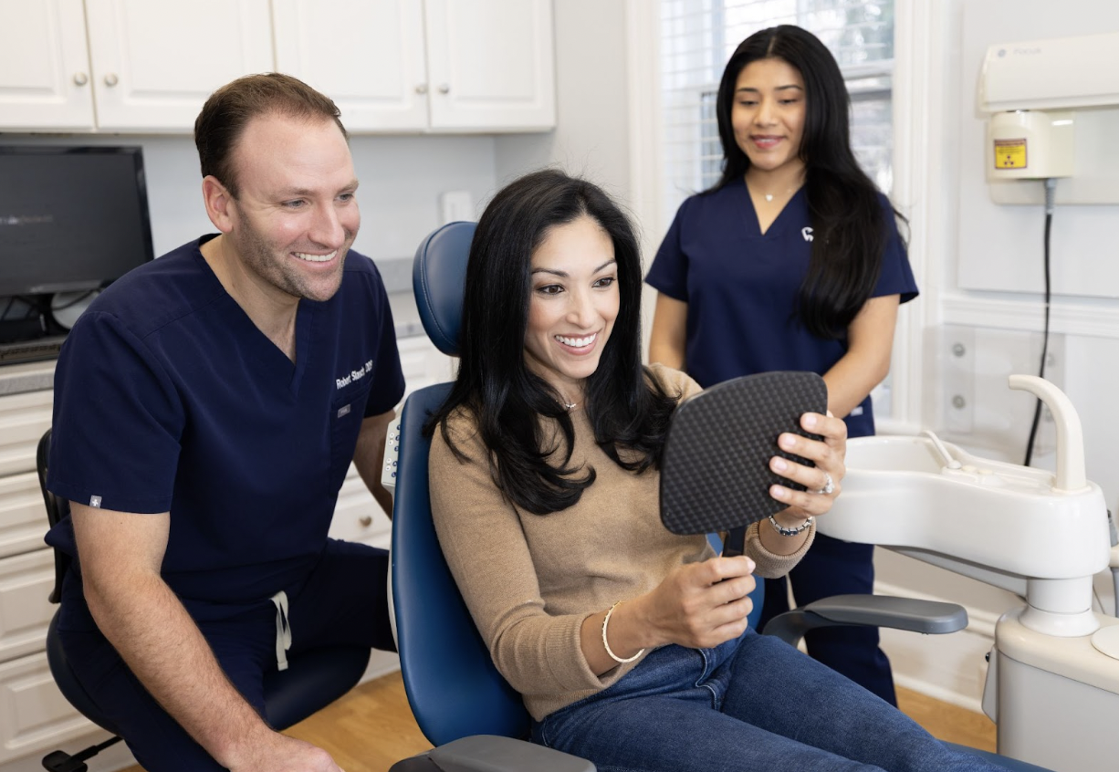 Smiling patient receiving professional teeth whitening treatment at Pennington Dental Associates to restore their bright smile