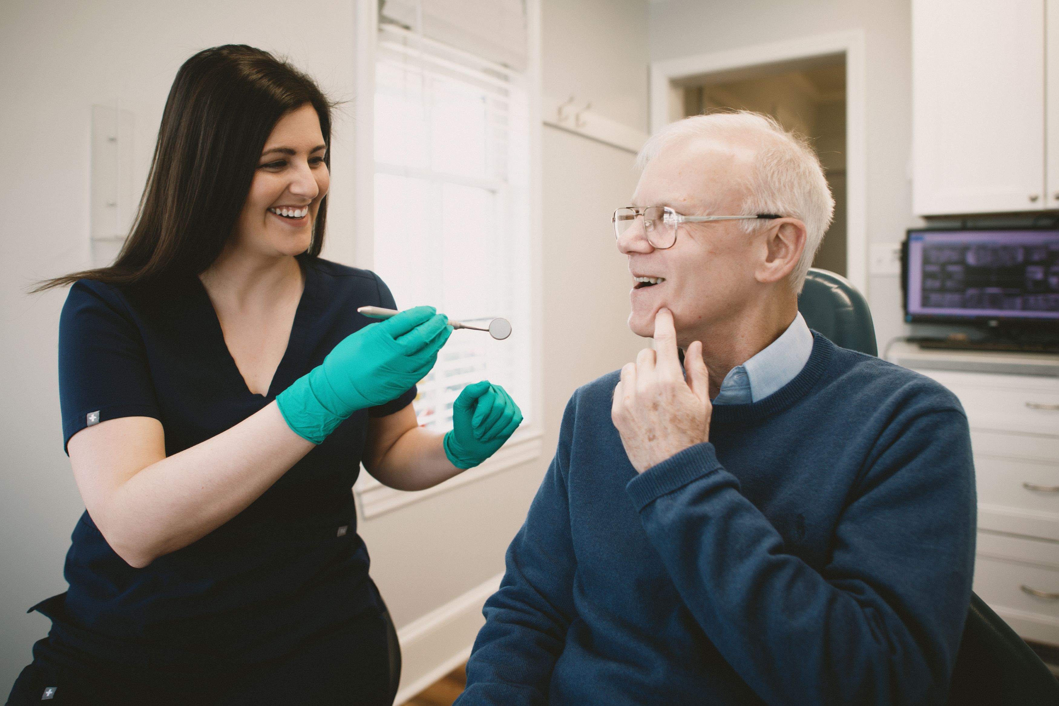Patient receiving dental implants at Pennington Dental Associates, restoring smile and oral health after tooth loss