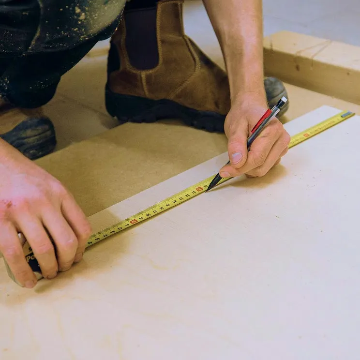 installer measuring flooring