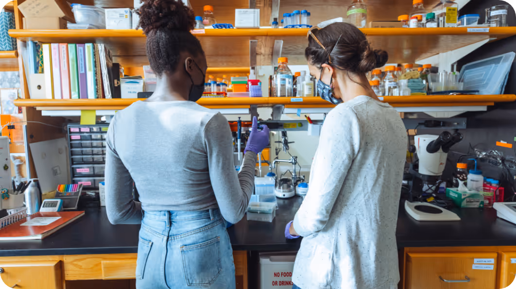 A researcher and Dr. O'Connell pipetting 