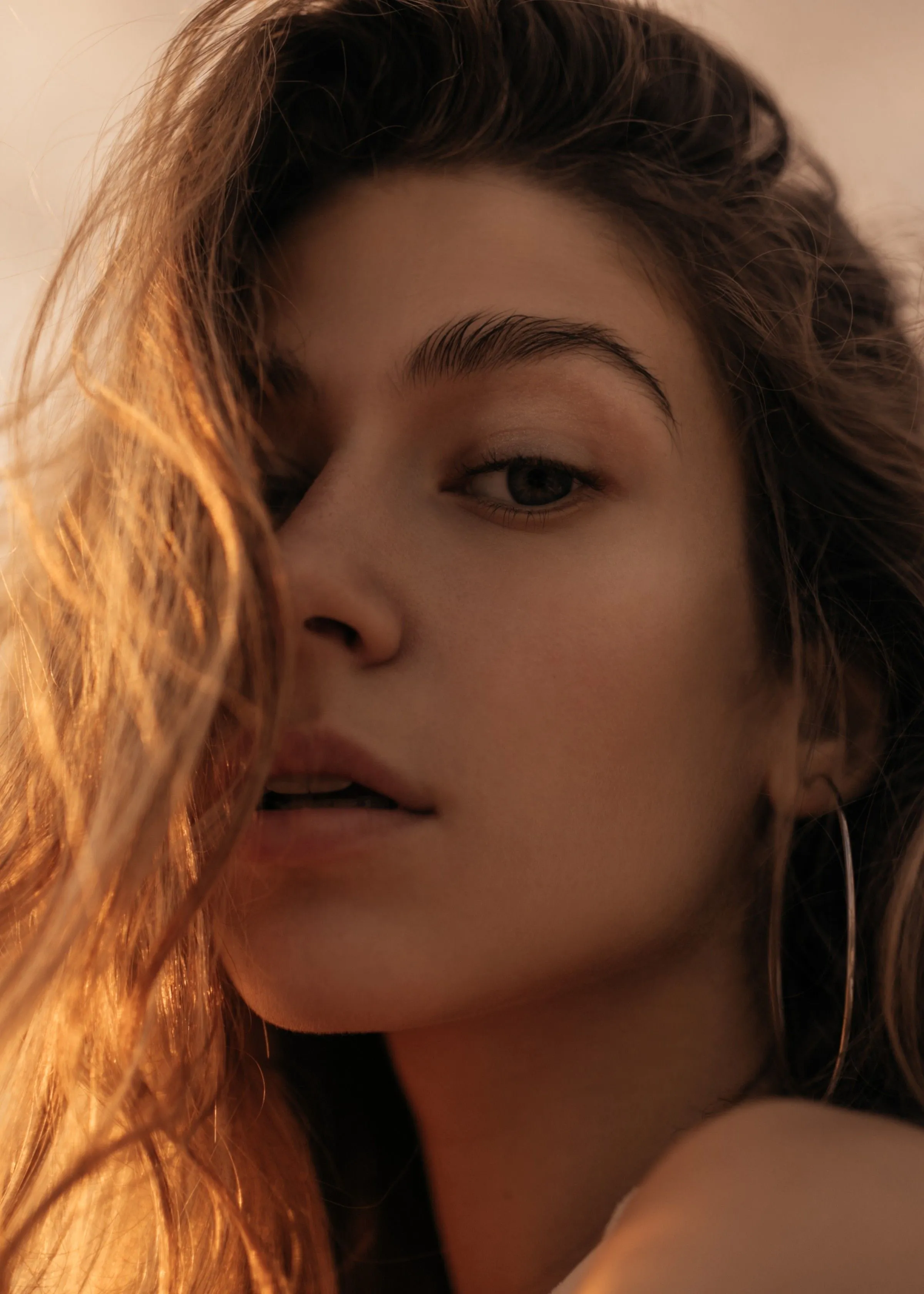 A close up of a person with long hair.