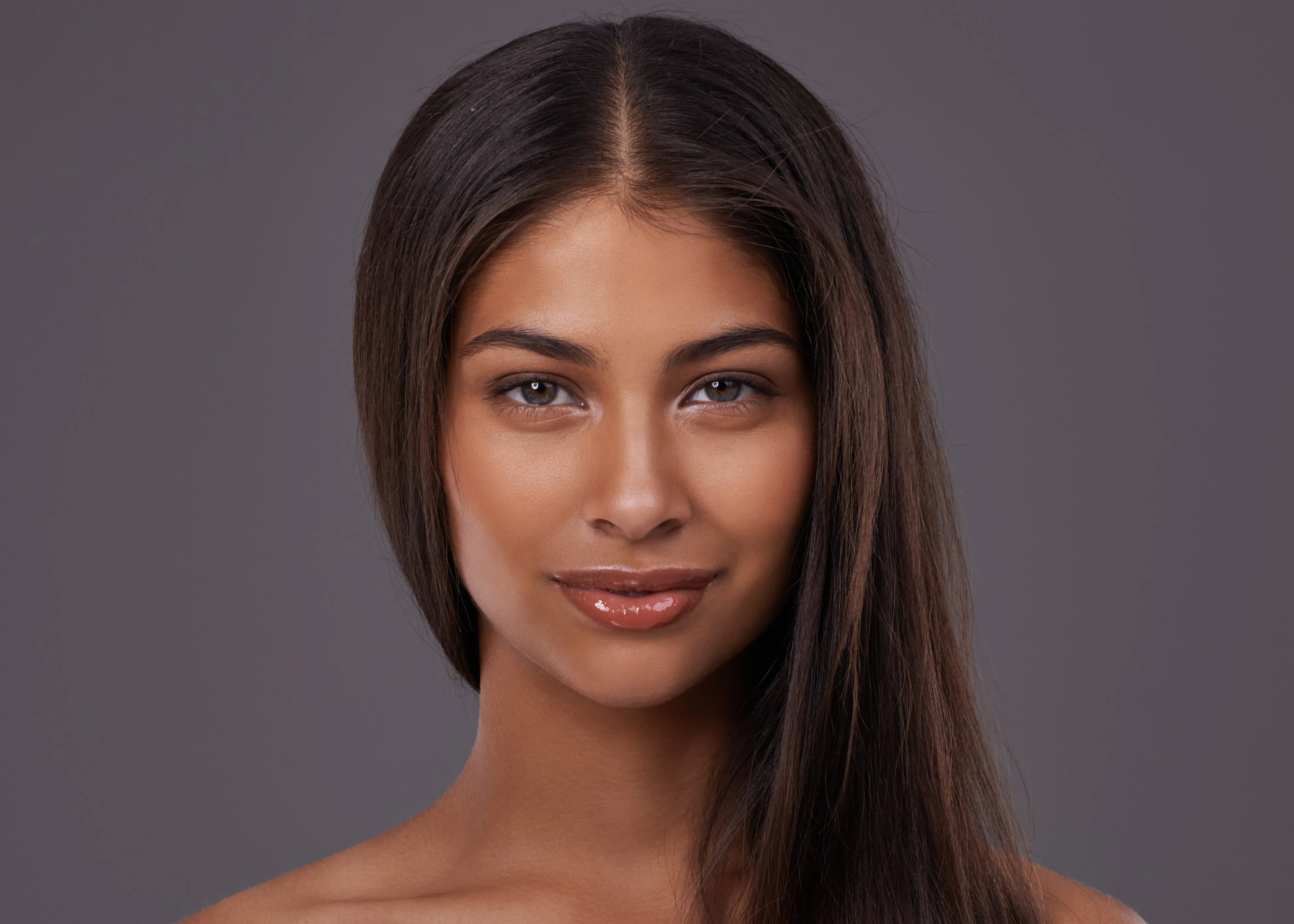 A beautiful young woman with long brown hair.
