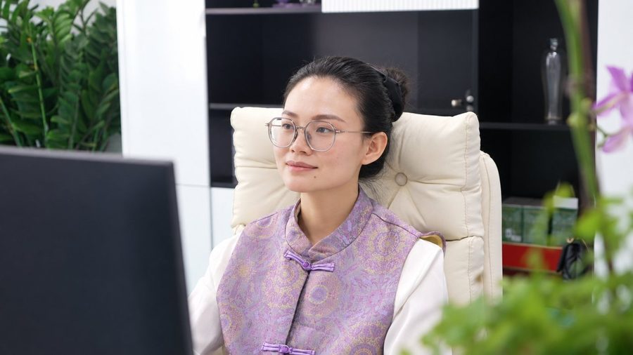 Louisa working at her desk in the LecSnow office