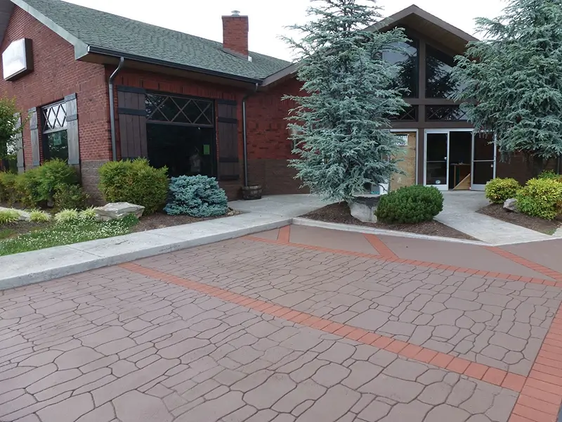 Refinished driveway with patterned asphalt