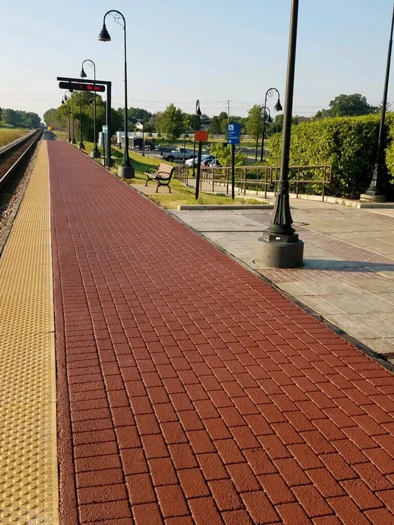 stamped asphalt at a train stop for safety