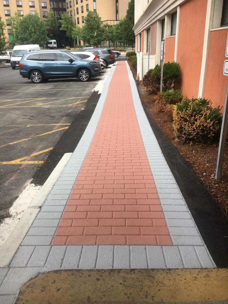 stamped sidewalk path by apartments