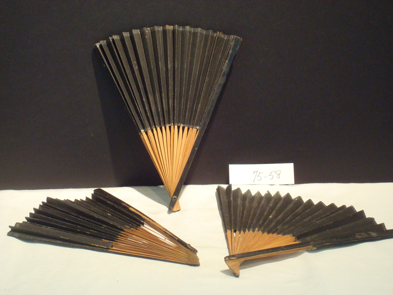 Collection of three vintage hand fans from Monterey, Massachusetts, representing personal accessories and craftsmanship from local history.