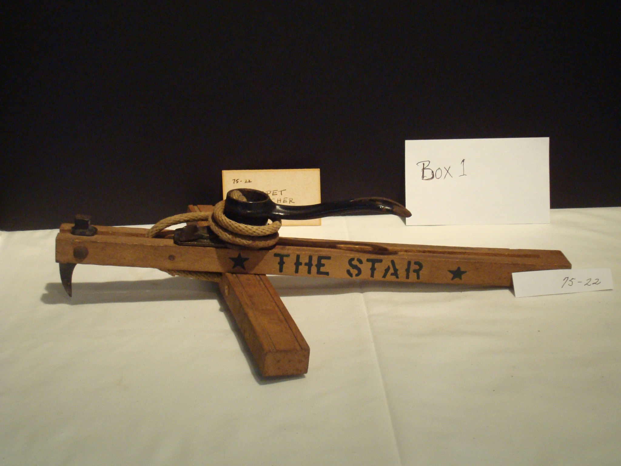 Antique carpet stretcher belonging to Nina Tryon, stored in Box 1, representing early home maintenance tools from Monterey, Massachusetts.