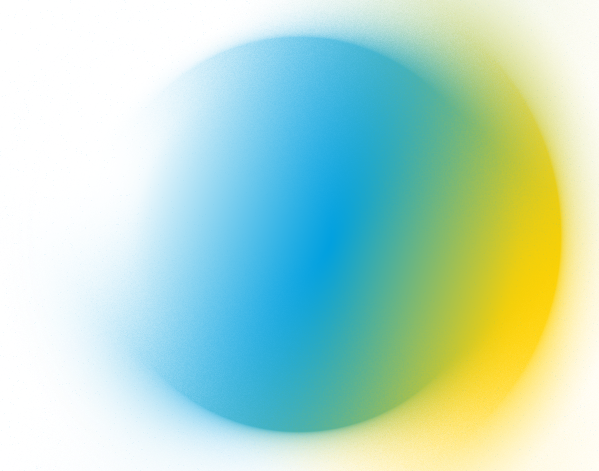 Student works at a computer and looks toward 3d printer.