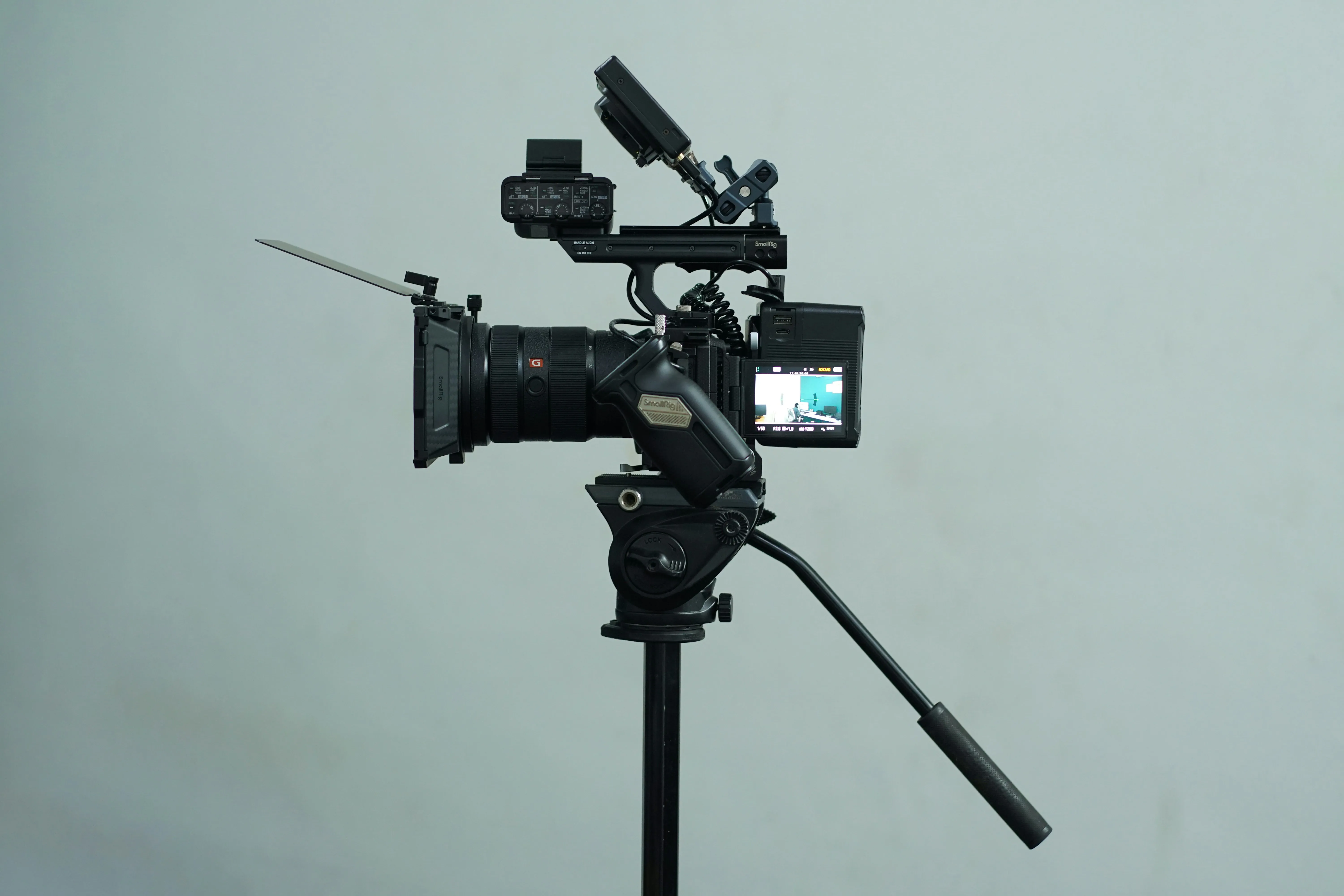 Video camera on a tripod within a studio