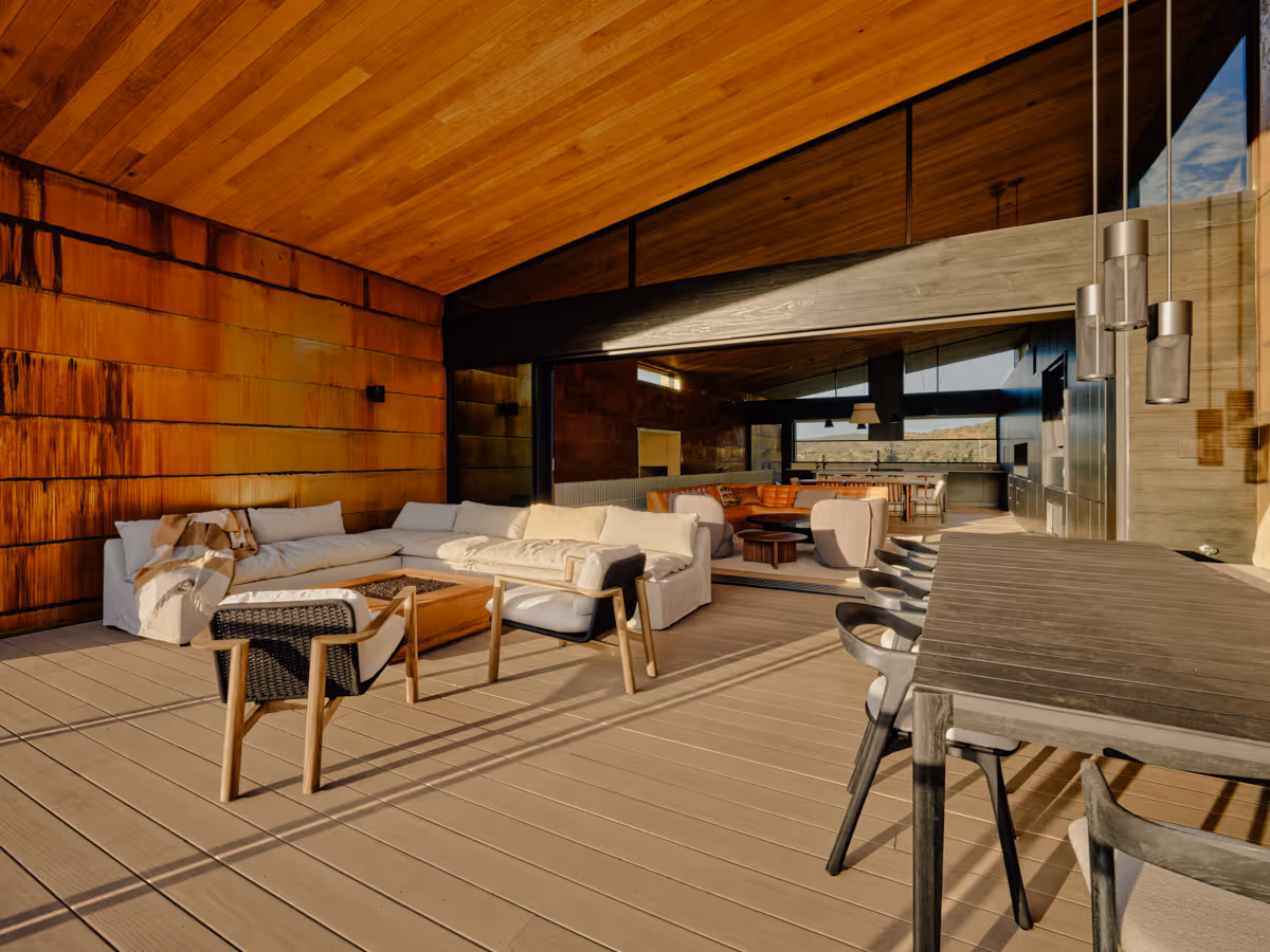 Covered patio with red rock views at Fox a modern desert home in Sedona