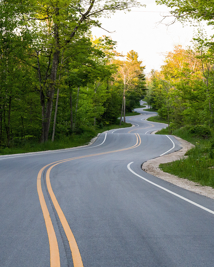 winding rural highway representing long-distance towing service and how the lengths we will go for out clients