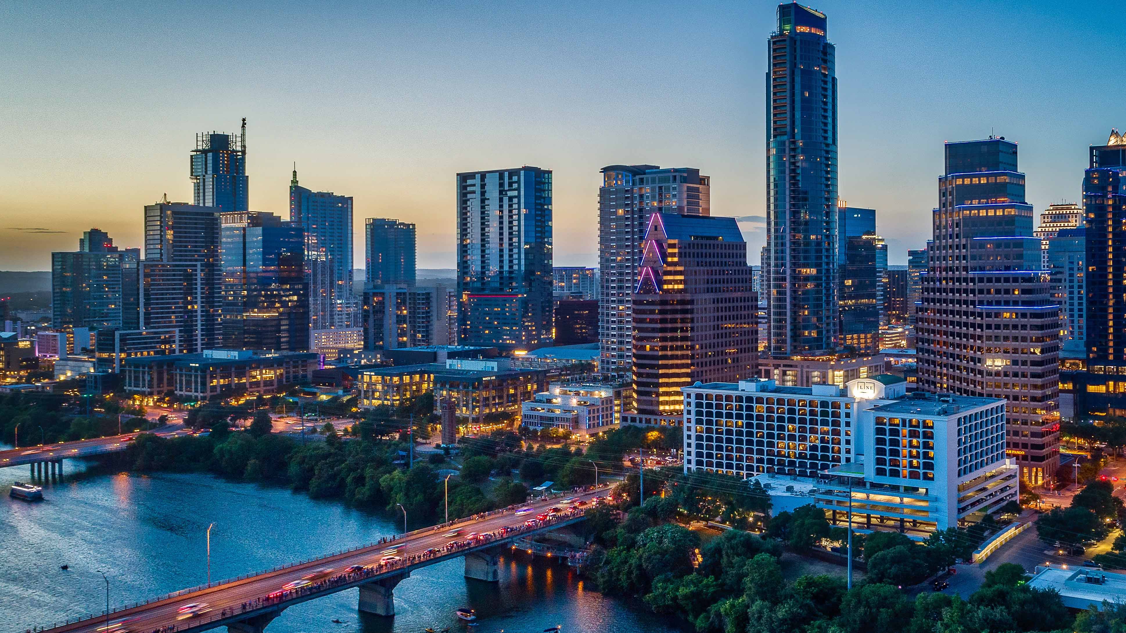 Austin skyline at dusk overlooking city river and downtown buildings