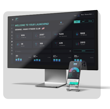 Computer monitor and smartphone displaying a fitness club dashboard with statistics and data insights.