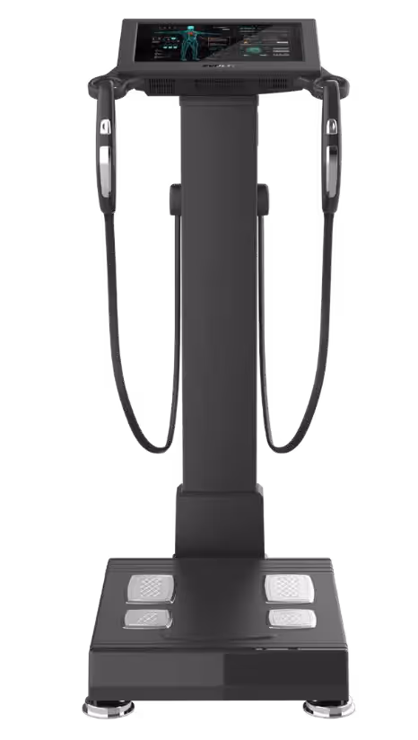 A black body composition analyzer with a digital display at the top. It features two handles on the sides and four footpads on the base for user interaction.