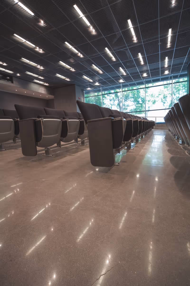 An auditorium with a polished concrete floor