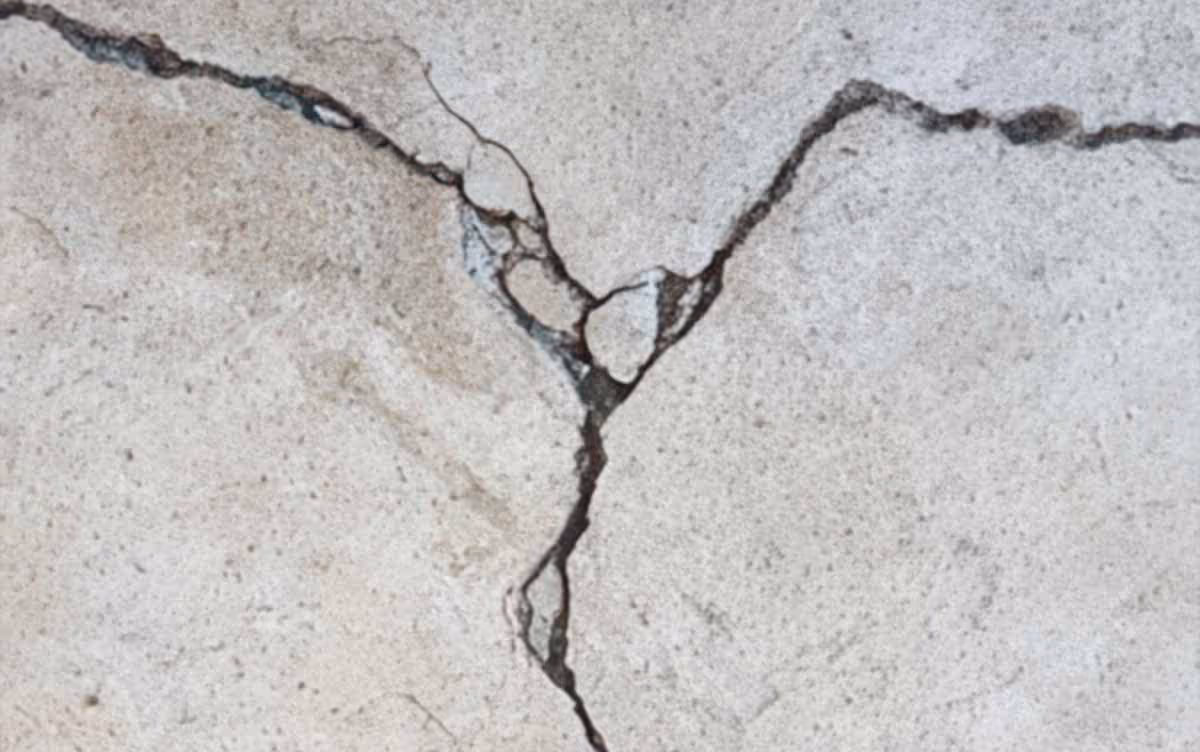 A large crack in concrete flooring