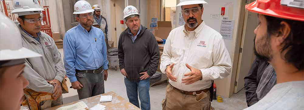 Engineers discussing a polished concrete job