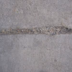 A minor joint repair in concrete flooring