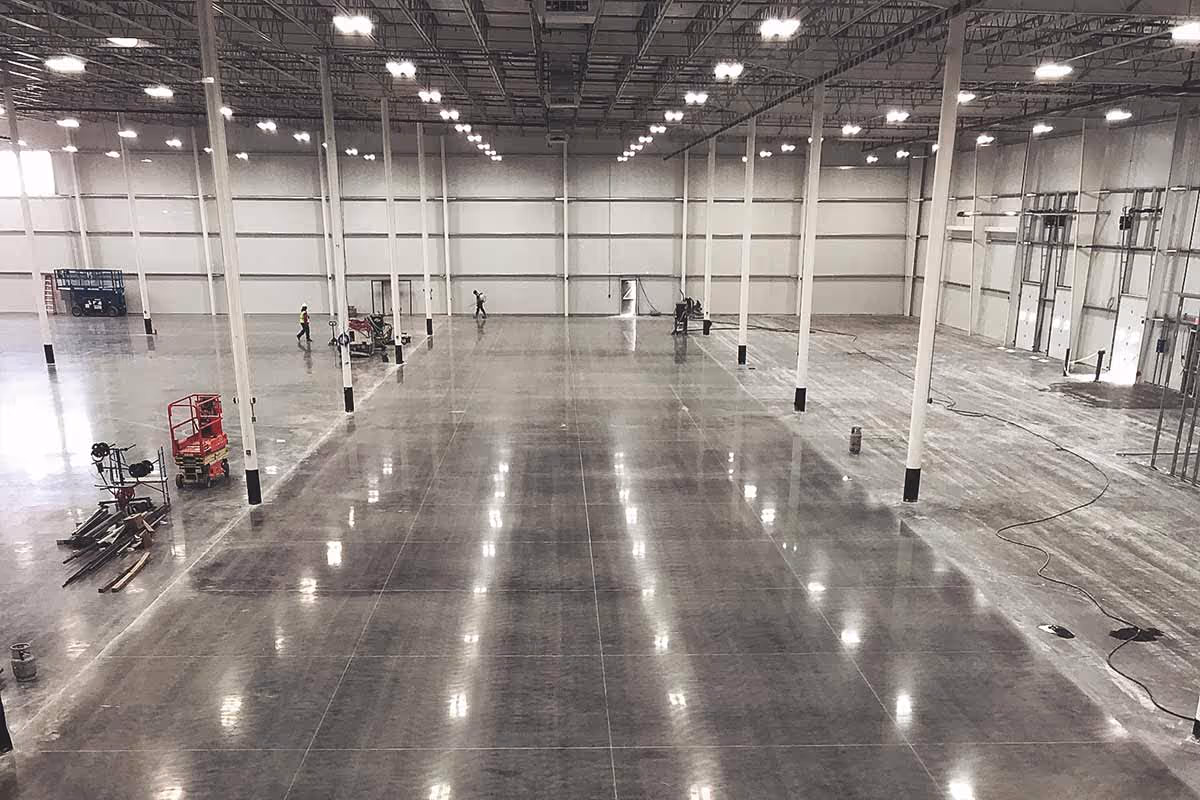 Industrial polished concrete flooring in a large warehouse