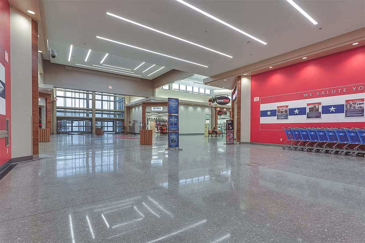 Polished concrete floor inside of a mall hallway
