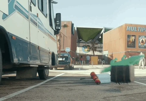 Animation of a variety of detritus falling out of the door of an RV