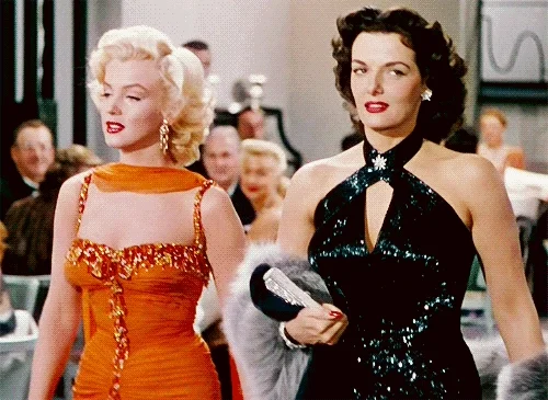 Animated image of Marilyn Monroe walking alongside another woman