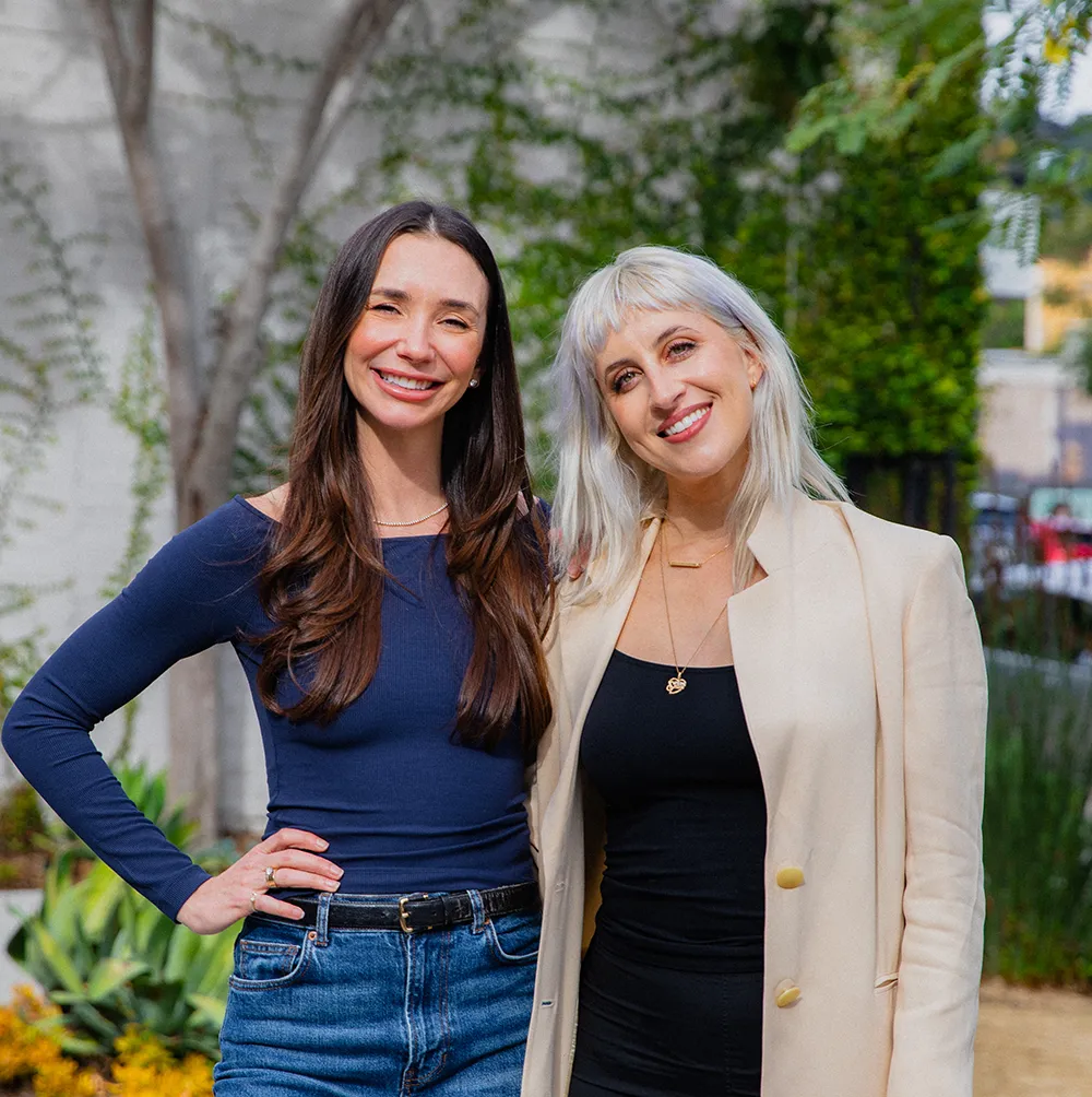 Photo of Blaine and Merav standing next to each other, smiling