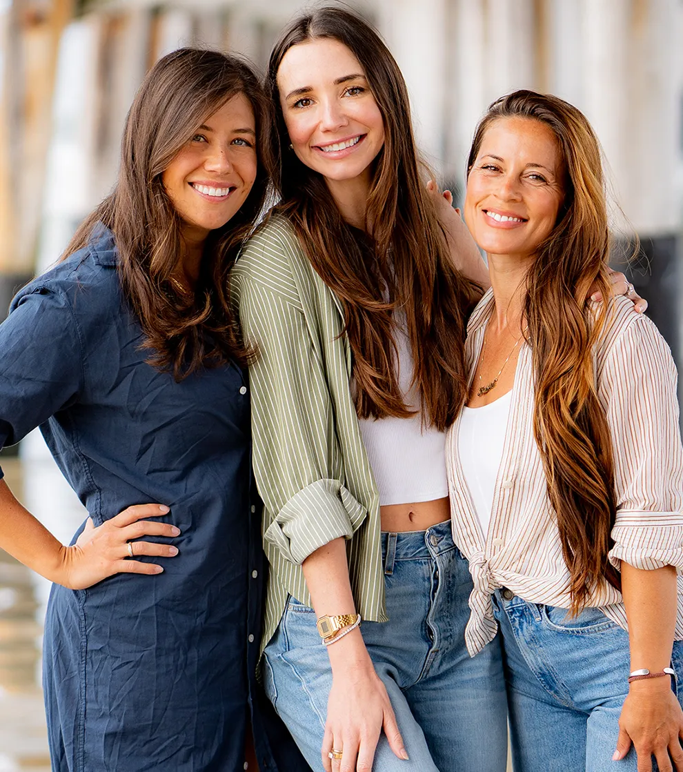 Photo of Blaine, Tara, and Kahlah on the beach, smiling